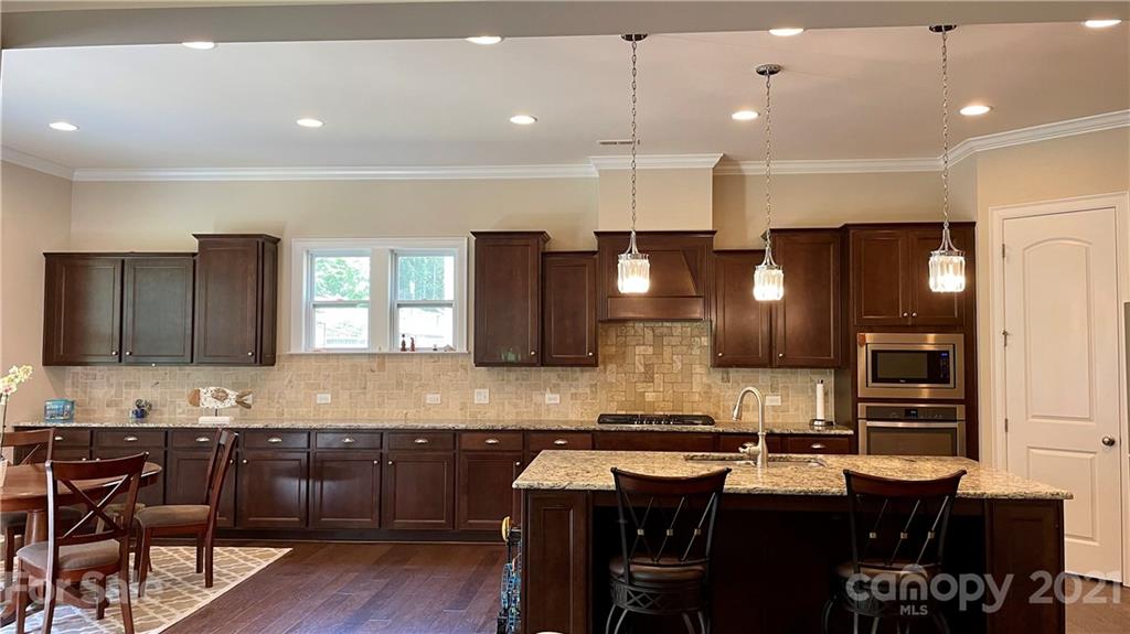 1538 Afton Way Fort Mill, SC 29708 - Photo 8 of 47 a kitchen with a sink cabinets and wooden floor