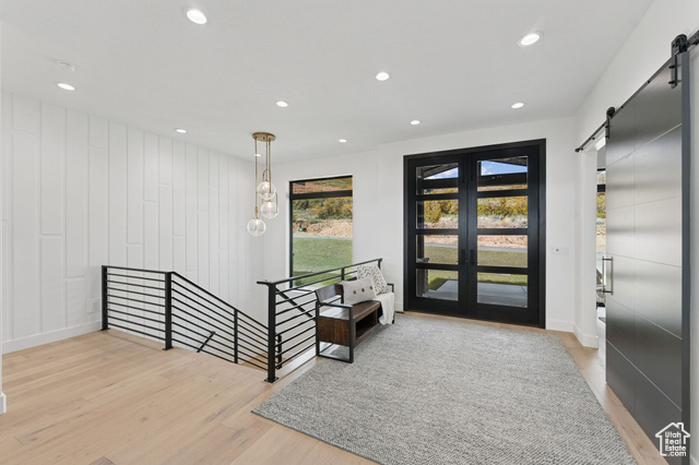 2280 East Outlaw Road, Unit 56 Kamas, UT 84036 - Photo 10 of 59 Entrance foyer featuring a barn door, light wood-style flooring, and recessed lighting