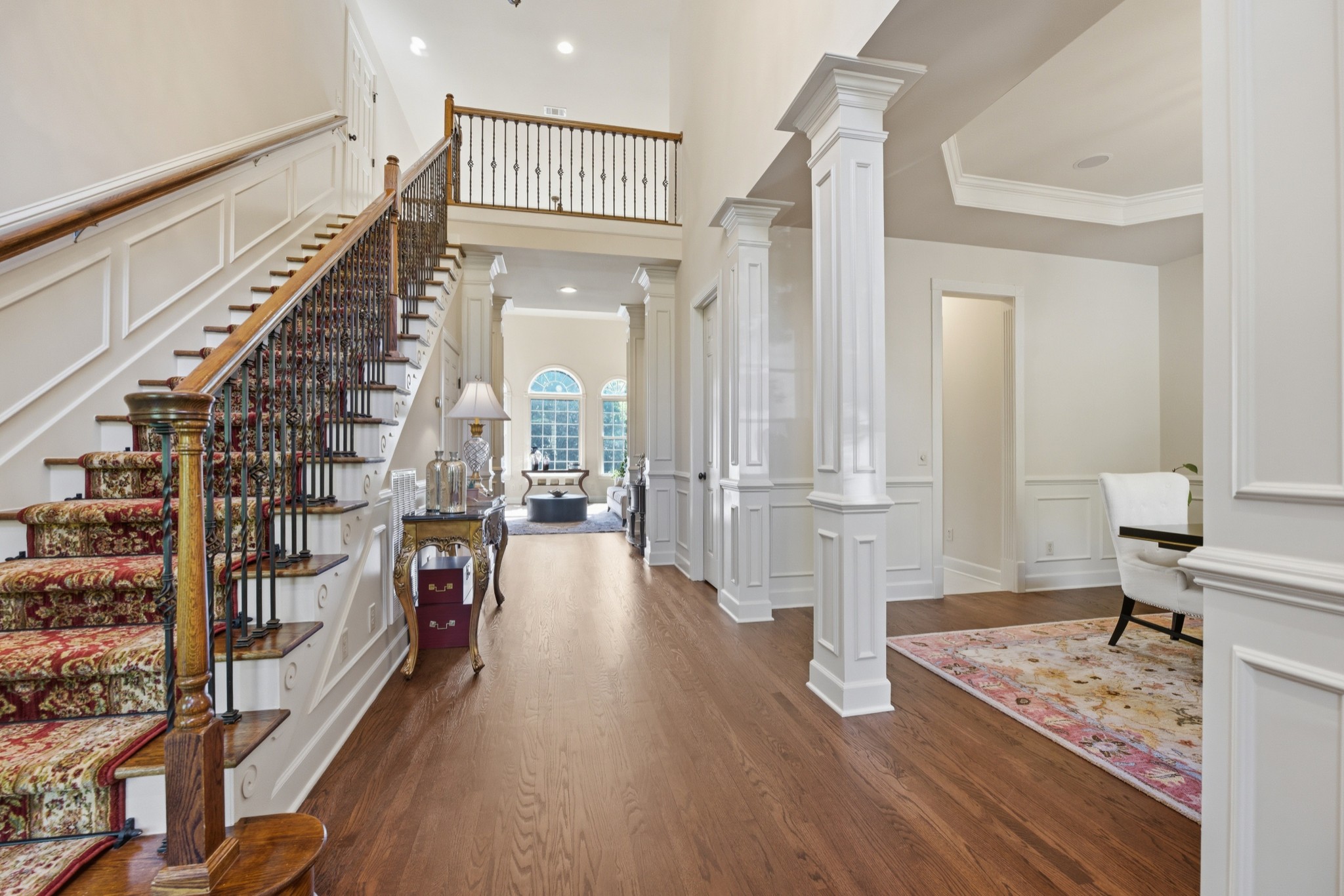 319 Hamlets End Way Franklin, TN 37067 - Photo 7 of 54 a view of a hallway with wooden floor and staircase