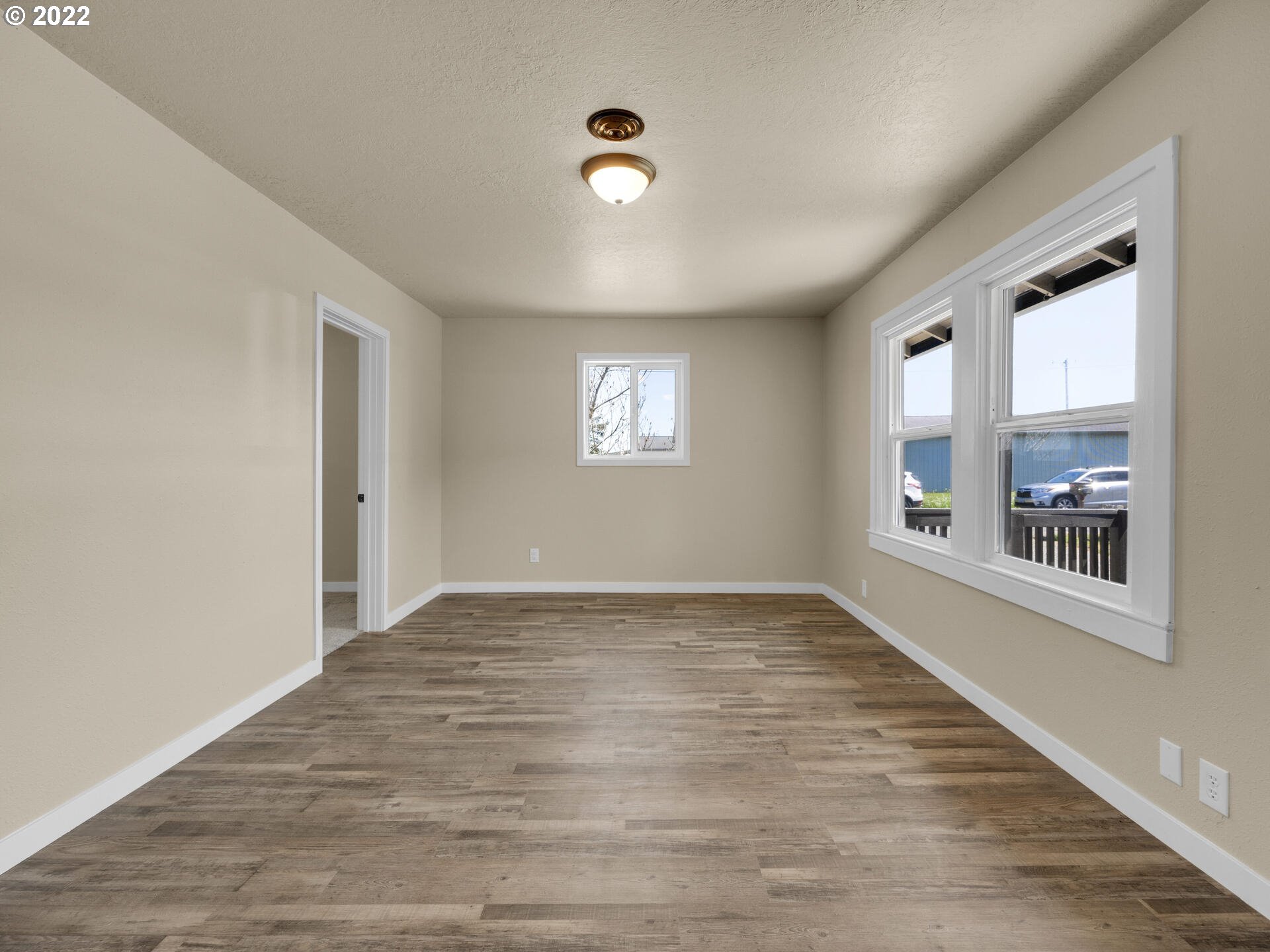 92356 E Road Astoria, OR 97103 - Photo 11 of 31 a view of an empty room with window and wooden floor
