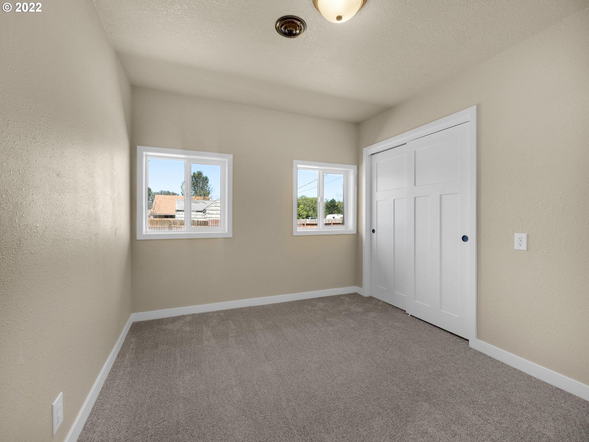 92356 E Road Astoria, OR 97103 - Photo 13 of 31 an empty room with windows and closet