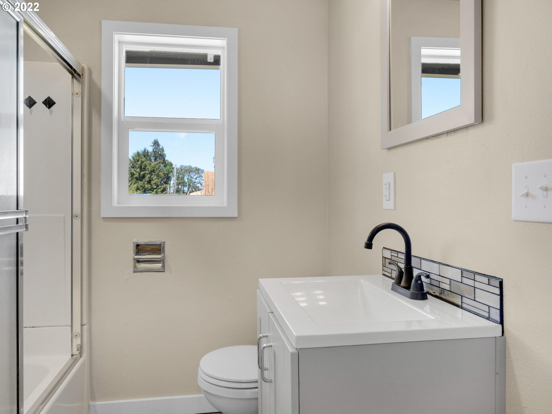 92356 E Road Astoria, OR 97103 - Photo 14 of 31 a bathroom with a toilet sink and mirror