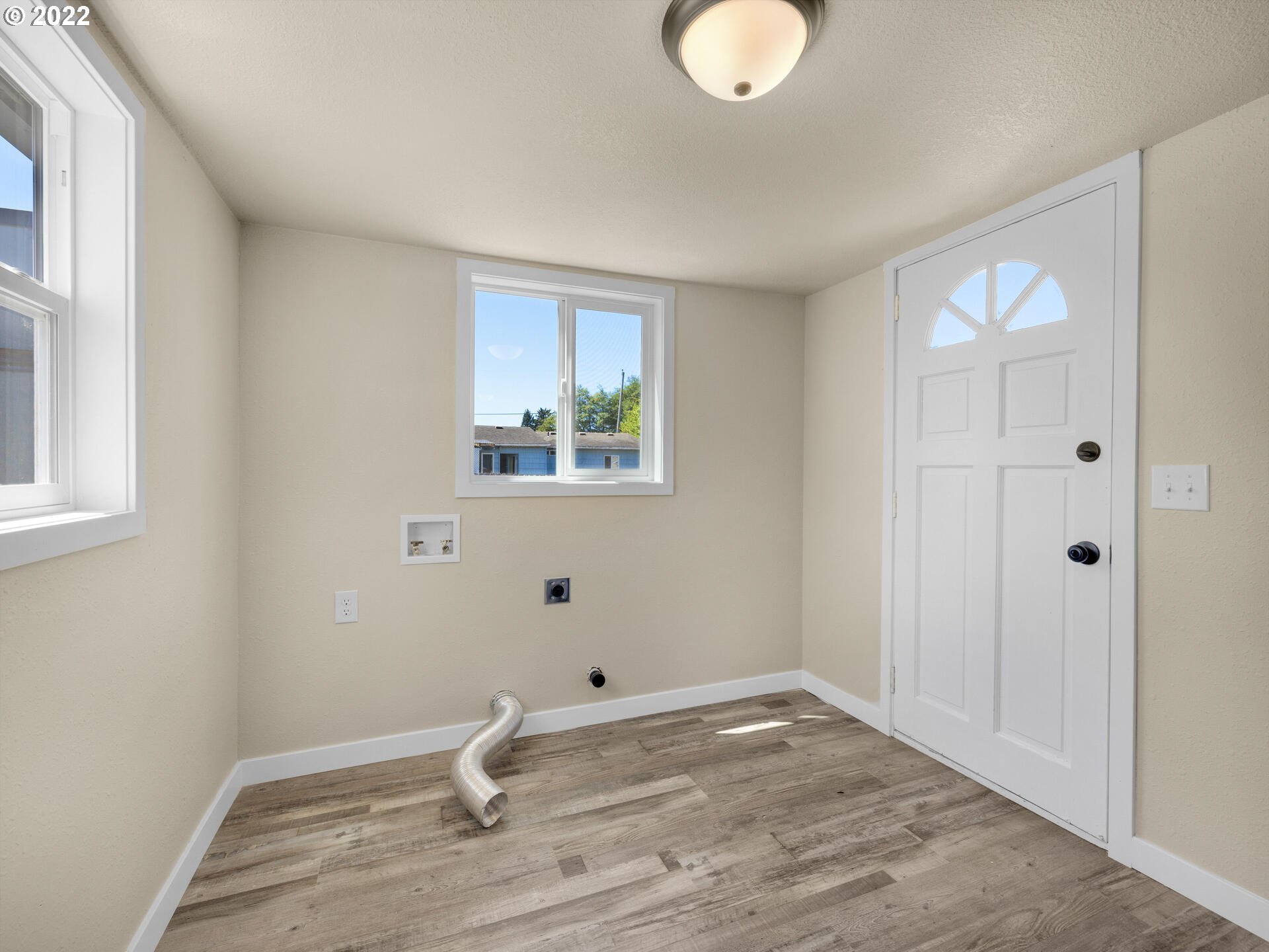 92356 E Road Astoria, OR 97103 - Photo 18 of 31 a view of a room with wooden floor and window