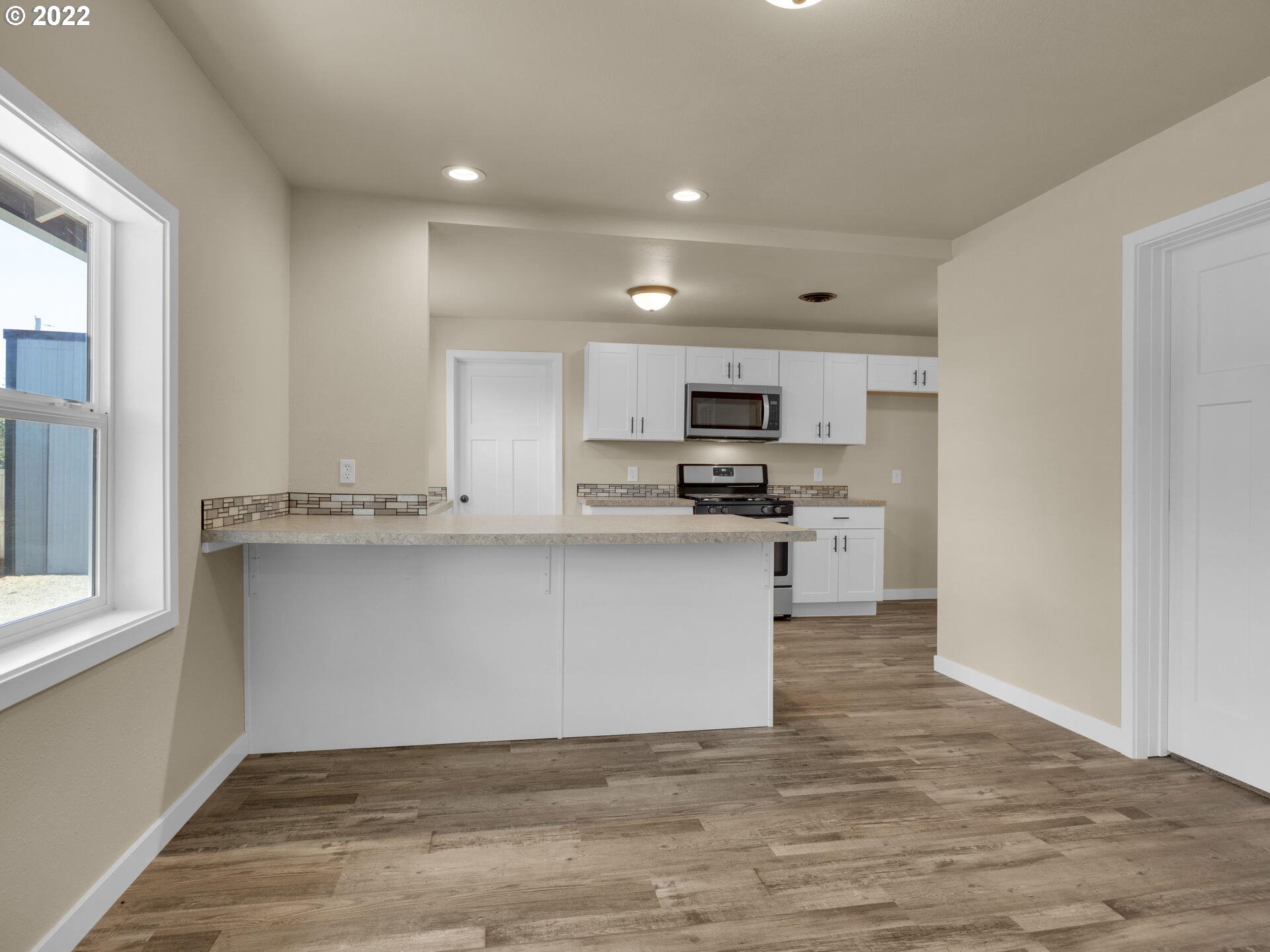 92356 E Road Astoria, OR 97103 - Photo 9 of 31 a view of kitchen with microwave and cabinets