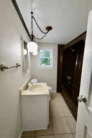 a bathroom with a sink a vanity and mirror