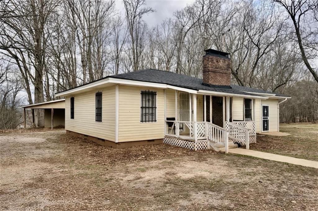 3911 Blackstock Road Talmo, GA 30575 - Photo 2 of 17 a view of a house with a yard