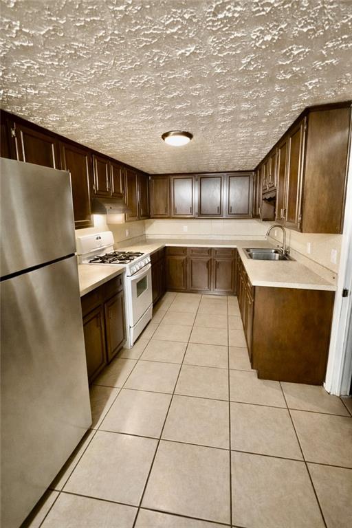 3911 Blackstock Road Talmo, GA 30575 - Photo 6 of 17 a kitchen with stainless steel appliances granite countertop a sink and cabinets