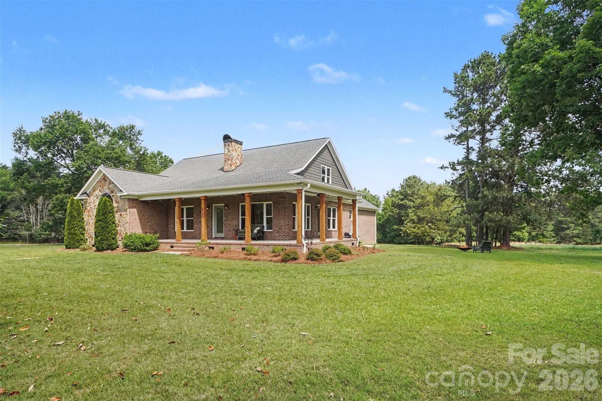 4445 Rowell Road Lancaster, SC 29720 - Photo 2 of 37 a front view of a house with a garden