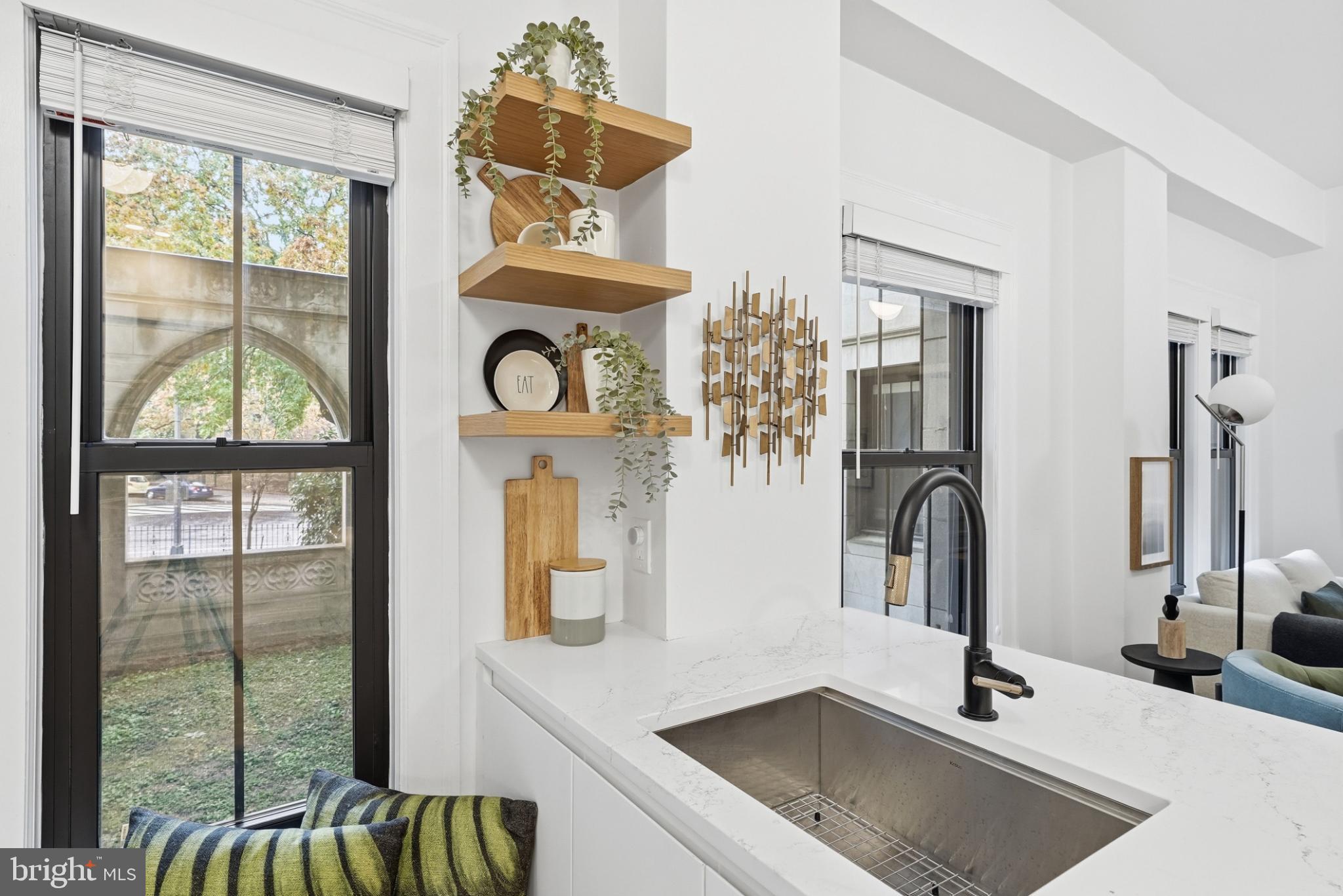 1613 Harvard Street Northwest, Unit 102 Washington, DC 20009 - Photo 4 of 21 a kitchen with a sink and a window