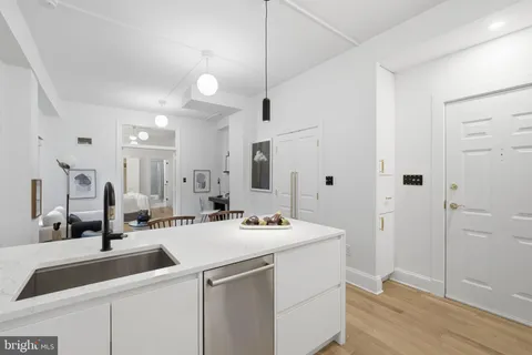 a kitchen with stainless steel appliances granite countertop a stove and a sink