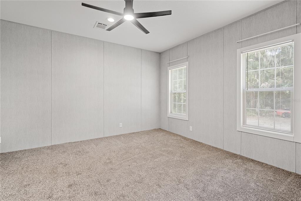 375 Sapp Street Inglis, FL 34449 - Photo 15 of 36 an empty room with a window and ceiling fan