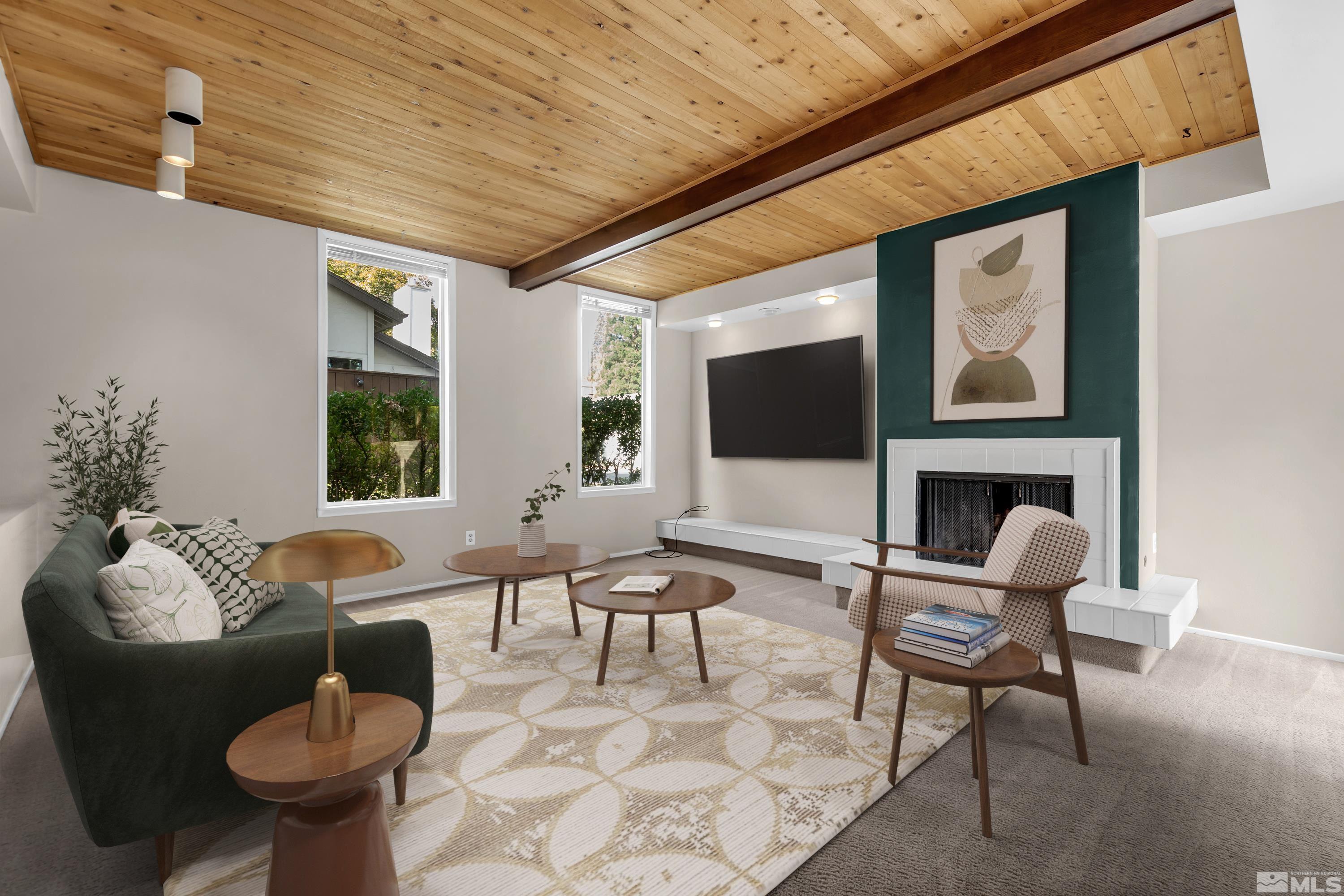 4001 Ruth Court Reno, NV 89509 - Photo 2 of 40 a living room with furniture a flat screen tv and a fireplace