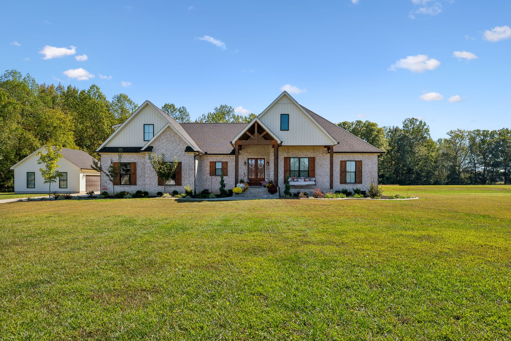 1338 Norton Road Manchester, TN 37355 - Photo 1 of 55 a front view of a house with yard and green space