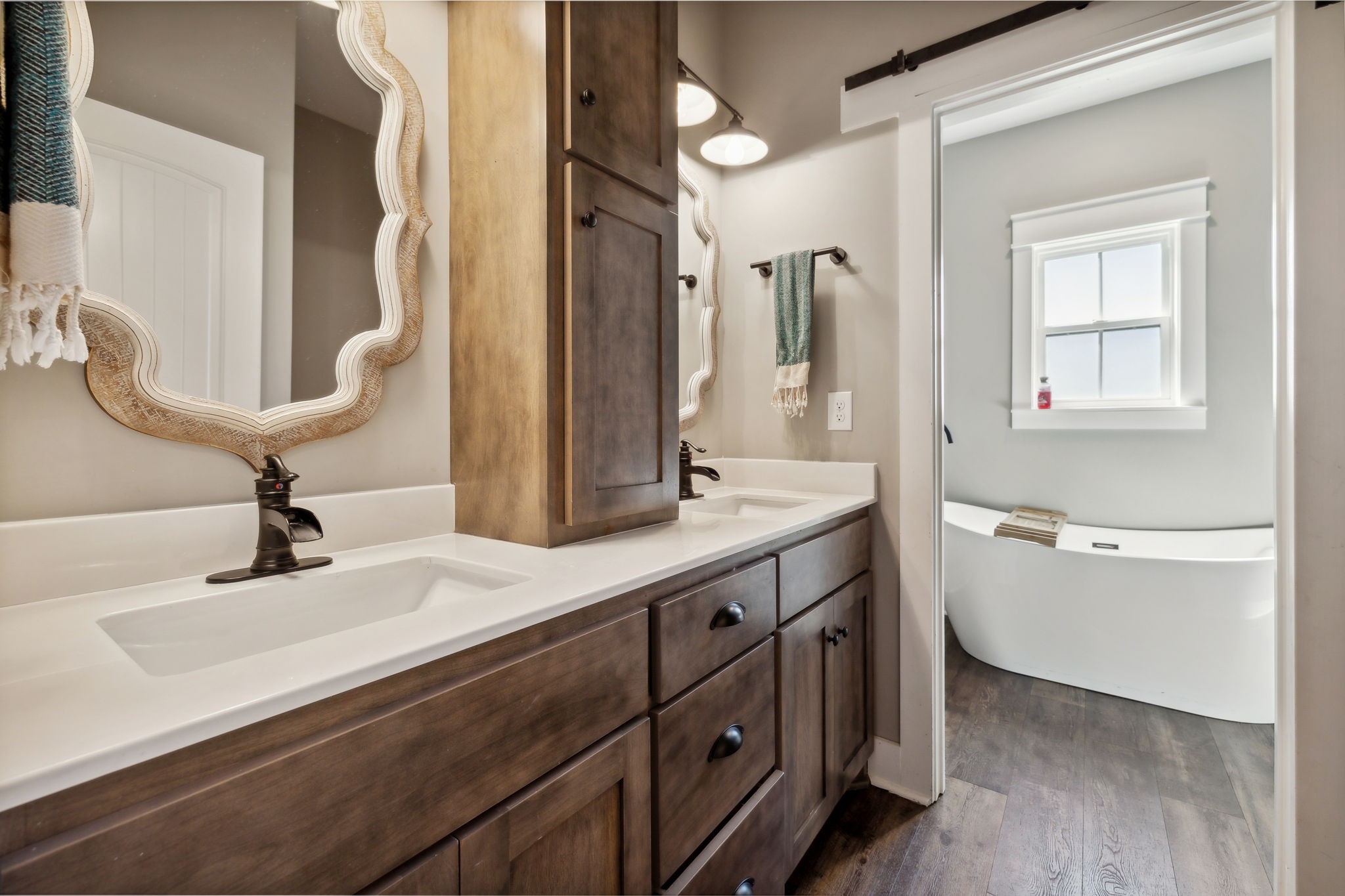 1338 Norton Road Manchester, TN 37355 - Photo 31 of 55 a bathroom with a double vanity sink and mirror