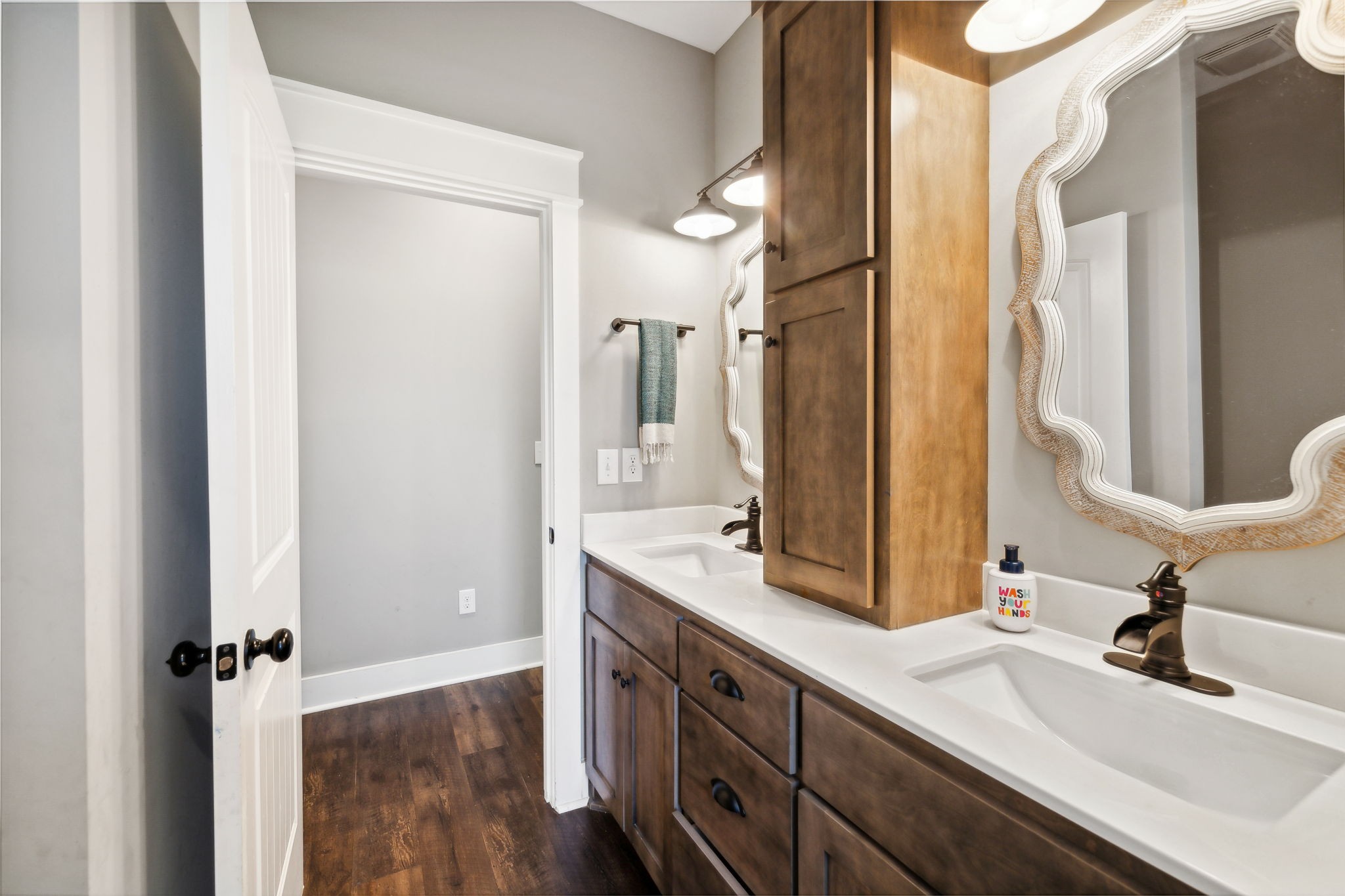 1338 Norton Road Manchester, TN 37355 - Photo 33 of 55 a bathroom with a double vanity sink and mirror