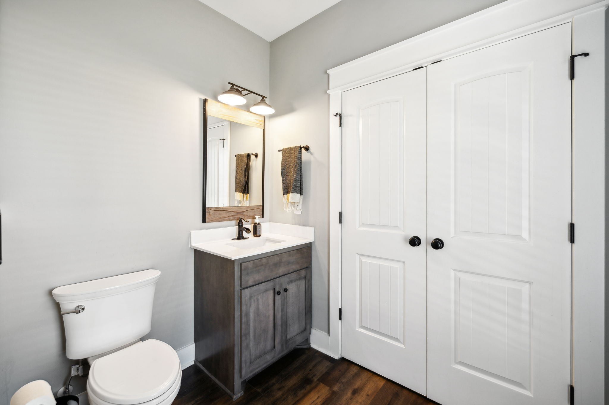 1338 Norton Road Manchester, TN 37355 - Photo 36 of 55 a bathroom with a toilet sink and mirror