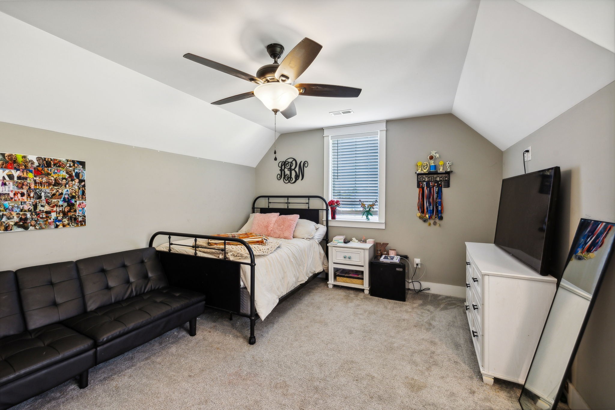 1338 Norton Road Manchester, TN 37355 - Photo 38 of 55 a bedroom with a bed couch and a flat screen tv