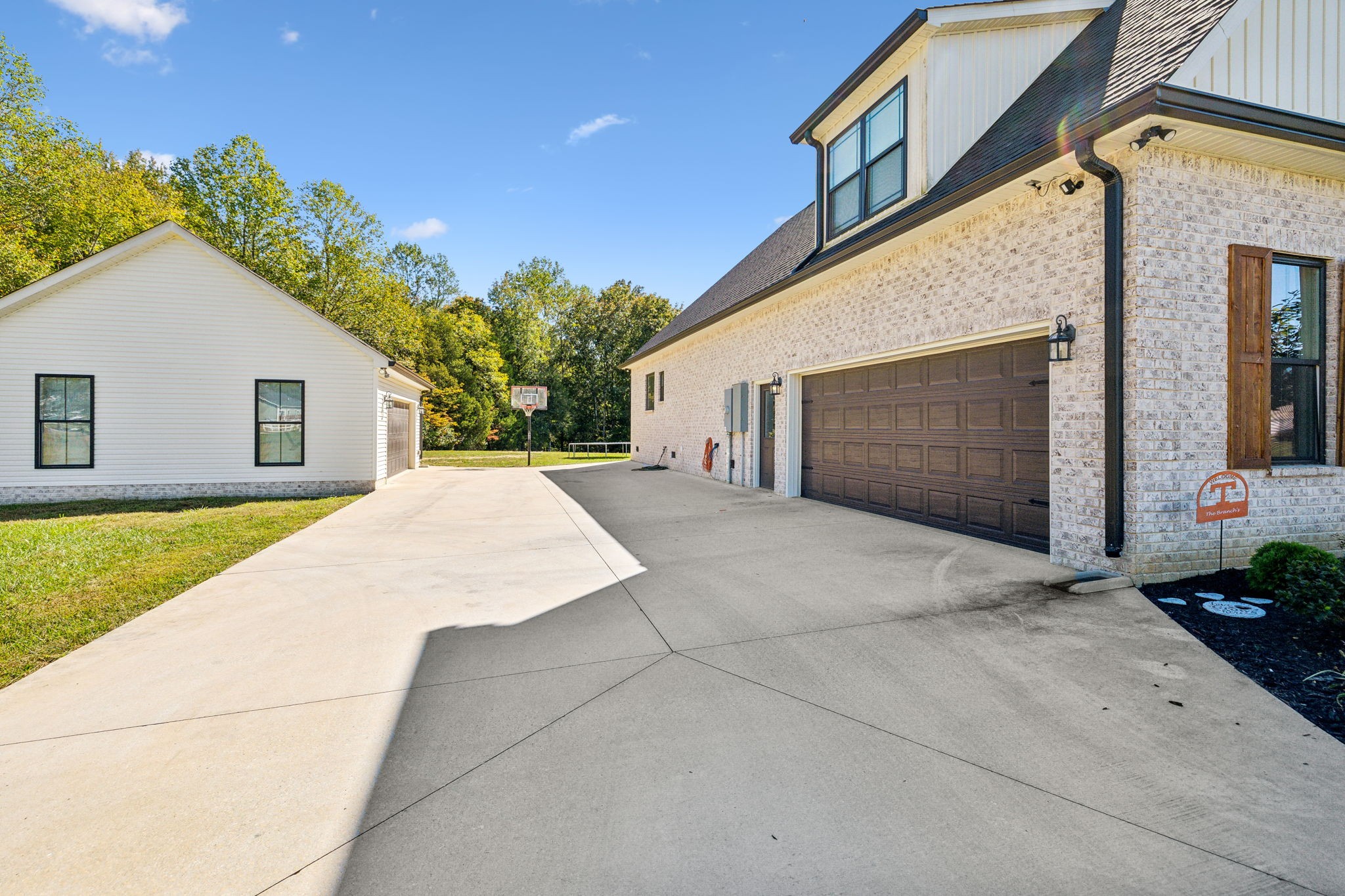 1338 Norton Road Manchester, TN 37355 - Photo 42 of 55 a view of a house with a backyard and a garage