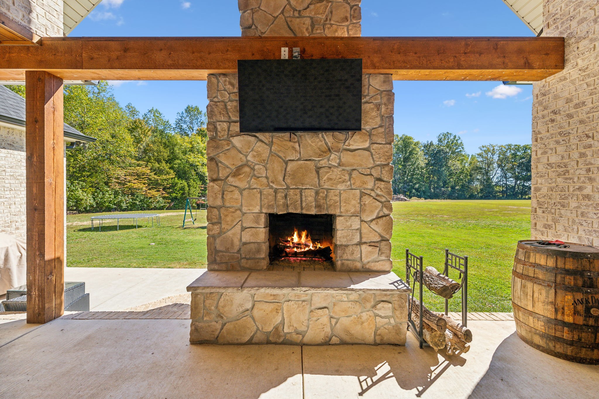 1338 Norton Road Manchester, TN 37355 - Photo 49 of 55 a living room with a fireplace and a flat screen tv
