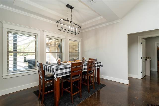 2151 Byrd Road Jacksonville, TX 75766 - Photo 14 of 40 a view of a dining room with furniture window and wooden floor