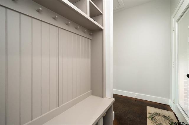 2151 Byrd Road Jacksonville, TX 75766 - Photo 17 of 40 Mudroom featuring baseboards and dark wood-style floors
