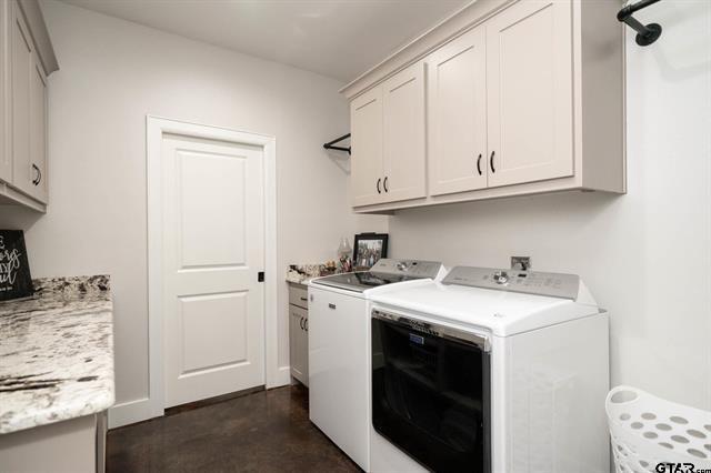 2151 Byrd Road Jacksonville, TX 75766 - Photo 18 of 40 a kitchen with stainless steel appliances granite countertop a sink stove and cabinets