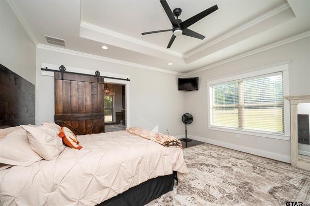2151 Byrd Road Jacksonville, TX 75766 - Photo 19 of 40 a bedroom with a large bed and a window