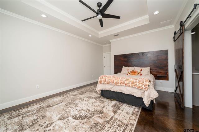 2151 Byrd Road Jacksonville, TX 75766 - Photo 20 of 40 a bedroom with a bed and a window
