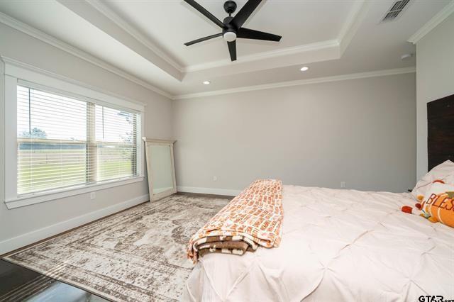 2151 Byrd Road Jacksonville, TX 75766 - Photo 21 of 40 a bedroom with a bed and a window