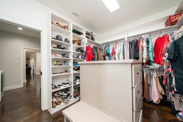 2151 Byrd Road Jacksonville, TX 75766 - Photo 22 of 40 a view of walk in closet with clothes and shoes