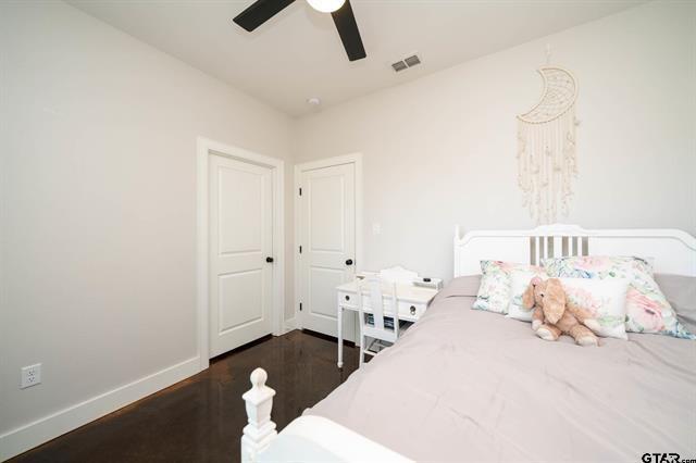 2151 Byrd Road Jacksonville, TX 75766 - Photo 27 of 40 Bedroom featuring dark wood-type flooring and a ceiling fan
