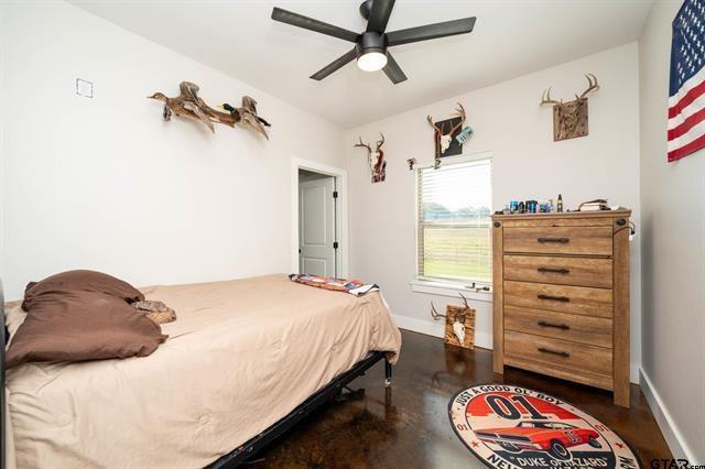 2151 Byrd Road Jacksonville, TX 75766 - Photo 28 of 40 a bedroom with a bed and a dresser