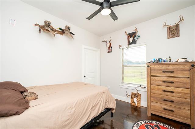 2151 Byrd Road Jacksonville, TX 75766 - Photo 30 of 40 a bedroom with a bed and a window