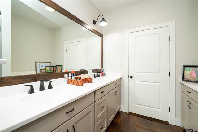 2151 Byrd Road Jacksonville, TX 75766 - Photo 32 of 40 a bathroom with a sink and a mirror