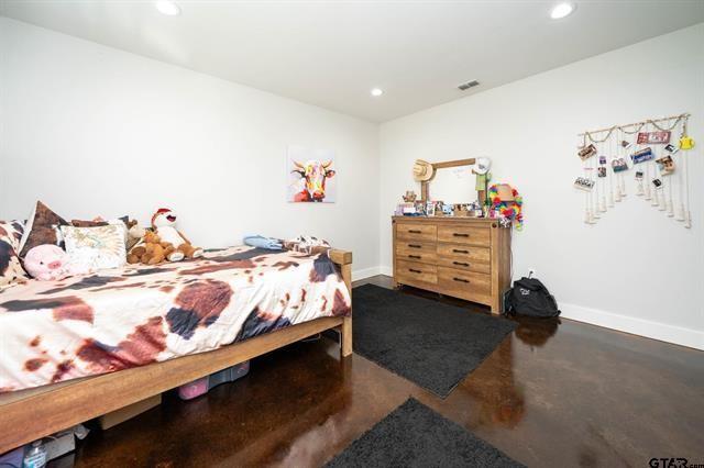 2151 Byrd Road Jacksonville, TX 75766 - Photo 35 of 40 a bedroom with a bed and dresser