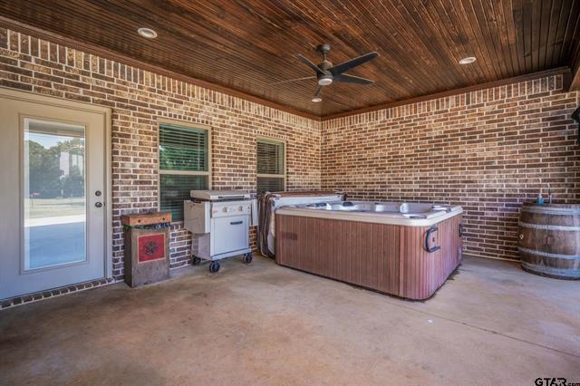 2151 Byrd Road Jacksonville, TX 75766 - Photo 36 of 40 View of patio / terrace with a hot tub and ceiling fan