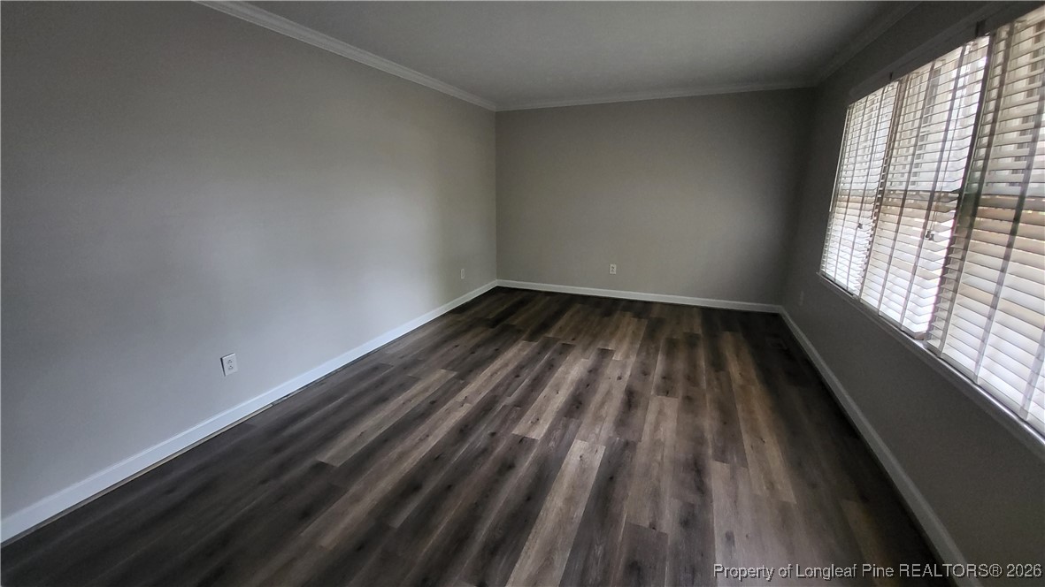 303 West 23rd Street Lumberton, NC 28358 - Photo 2 of 12 a view of wooden floor in a room