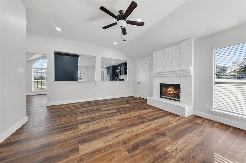 607 Rawlins Drive Lancaster, TX 75146 - Photo 14 of 26 a view of an empty room with window and fireplace