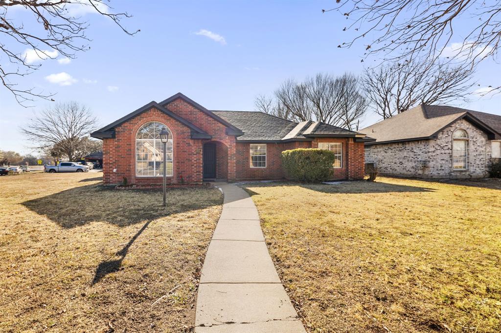 607 Rawlins Drive Lancaster, TX 75146 - Photo 3 of 26 a front view of a house with a yard
