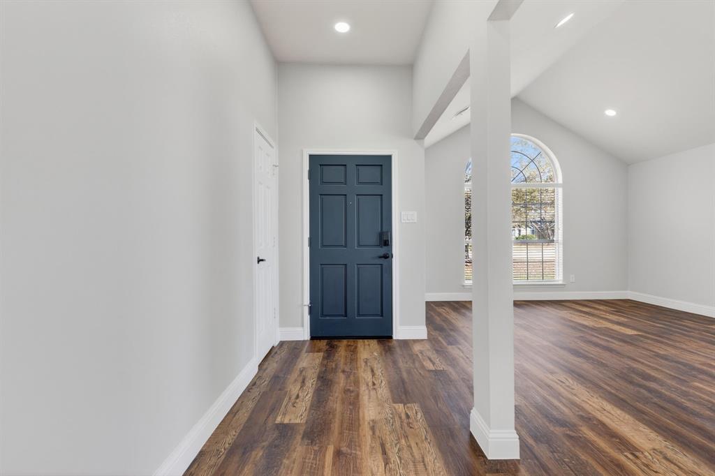 607 Rawlins Drive Lancaster, TX 75146 - Photo 6 of 26 wooden floor in an empty room with a window