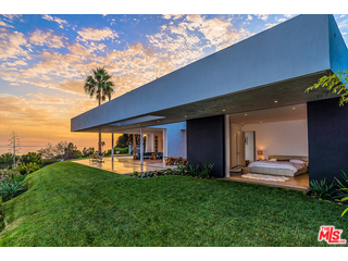 20659 Rockcroft Drive Malibu, CA 90265 - Photo 1 of 33 a front view of a house with a yard