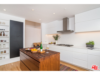 20659 Rockcroft Drive Malibu, CA 90265 - Photo 15 of 33 a kitchen with stainless steel appliances granite countertop a sink stove and cabinets