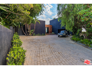 20659 Rockcroft Drive Malibu, CA 90265 - Photo 3 of 33 a row of car parked in front of house
