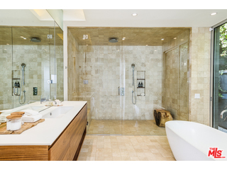 20659 Rockcroft Drive Malibu, CA 90265 - Photo 21 of 33 a bathroom with a tub shower and sink