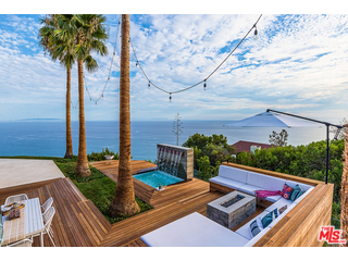 20659 Rockcroft Drive Malibu, CA 90265 - Photo 24 of 33 a view of a couches in the patio with potted plants