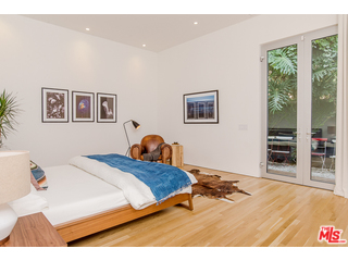 20659 Rockcroft Drive Malibu, CA 90265 - Photo 26 of 33 a bedroom with a bed and a view of kitchen