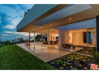 20659 Rockcroft Drive Malibu, CA 90265 - Photo 31 of 33 a swimming pool with outdoor seating and yard