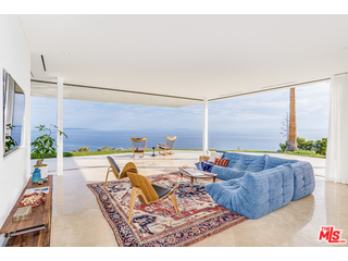 20659 Rockcroft Drive Malibu, CA 90265 - Photo 7 of 33 a living room with furniture and a large window