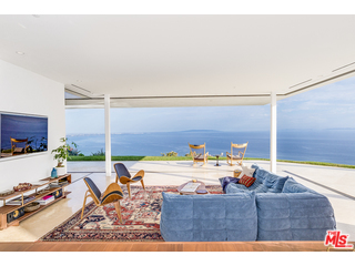 20659 Rockcroft Drive Malibu, CA 90265 - Photo 8 of 33 a living room with furniture and a flat screen tv