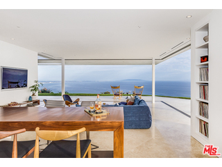 20659 Rockcroft Drive Malibu, CA 90265 - Photo 9 of 33 a living room with furniture and a flat screen tv